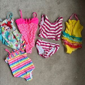 Various Pink and Yellow One Piece Swimsuits with Textured Details